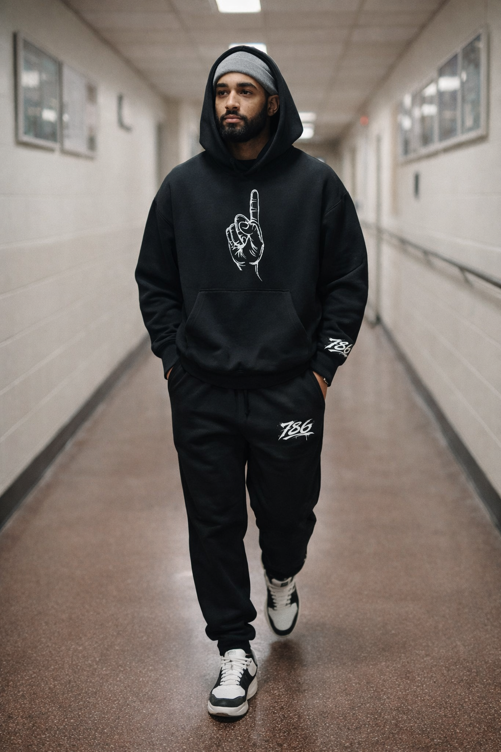Model walking in Halal Vibes 786 Tawheed Edition Hoodie and Joggers.