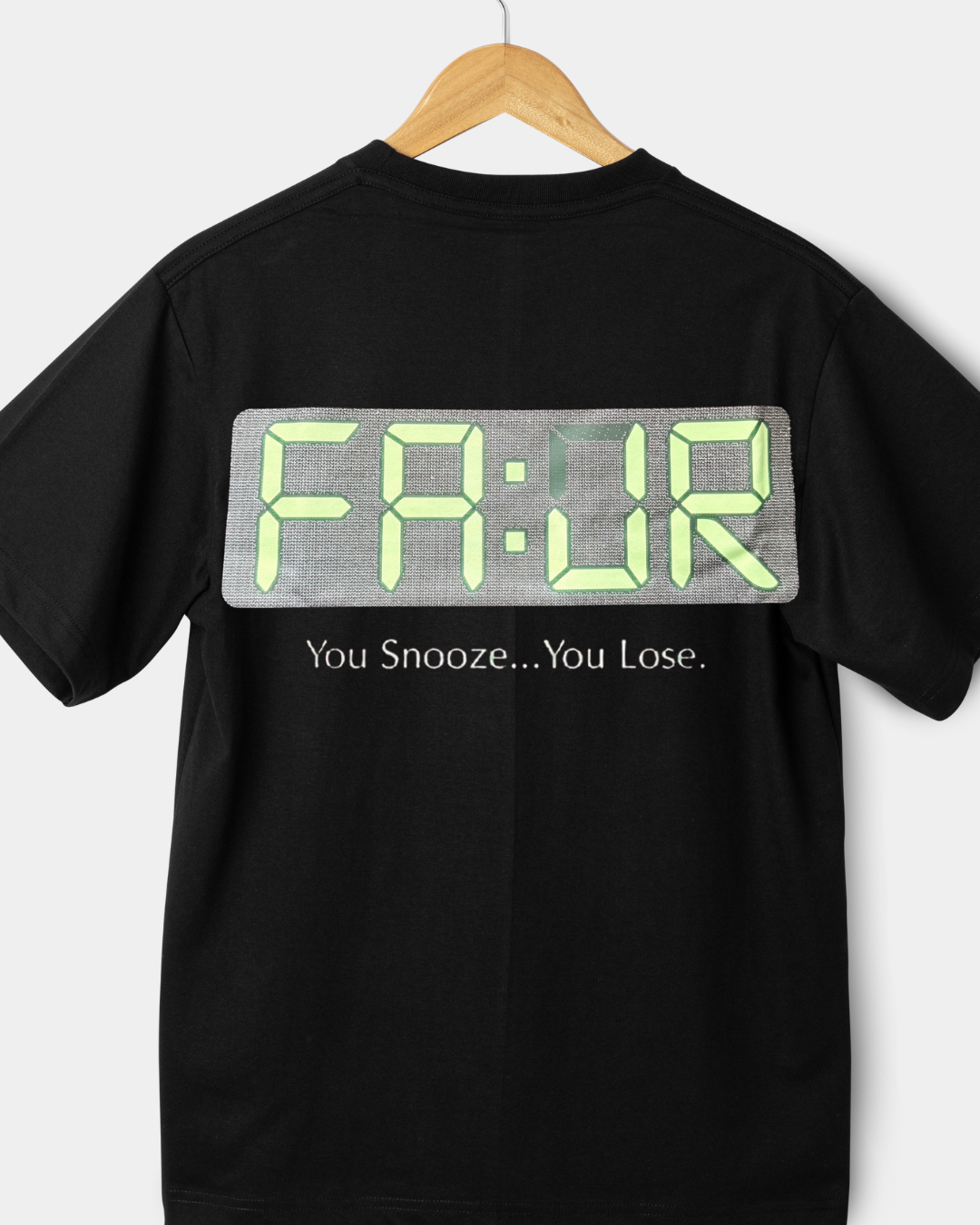 Black t-shirt with digital clock design and text on a white background