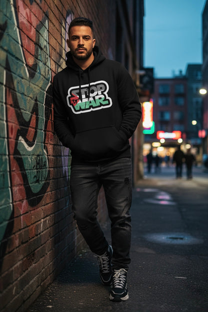 Person wearing a Stop War hoodie standing against a graffiti-covered wall on a city street.