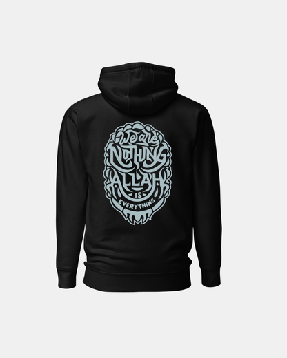 Black hoodie with white graphic design on the back against a light gray background