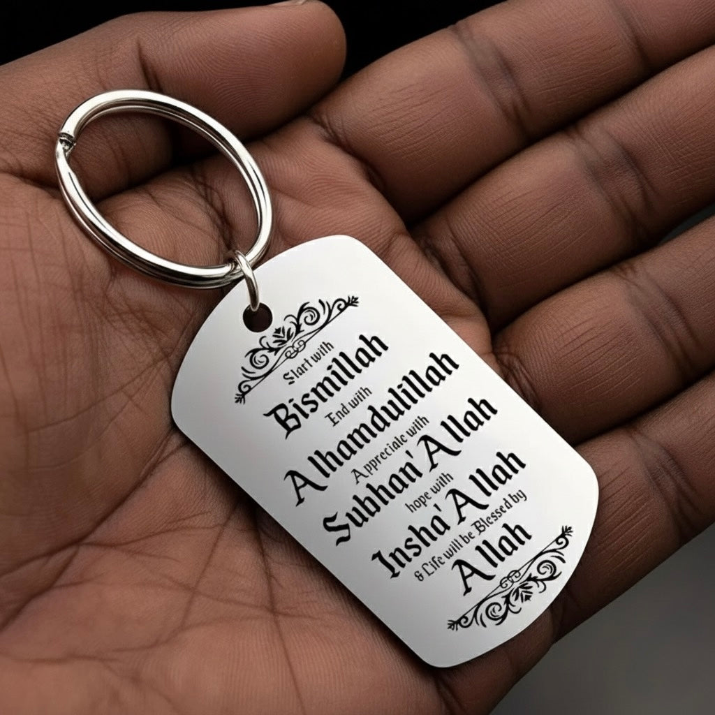 Close up of engraved Islamic message on mirror-polished stainless steel keyring