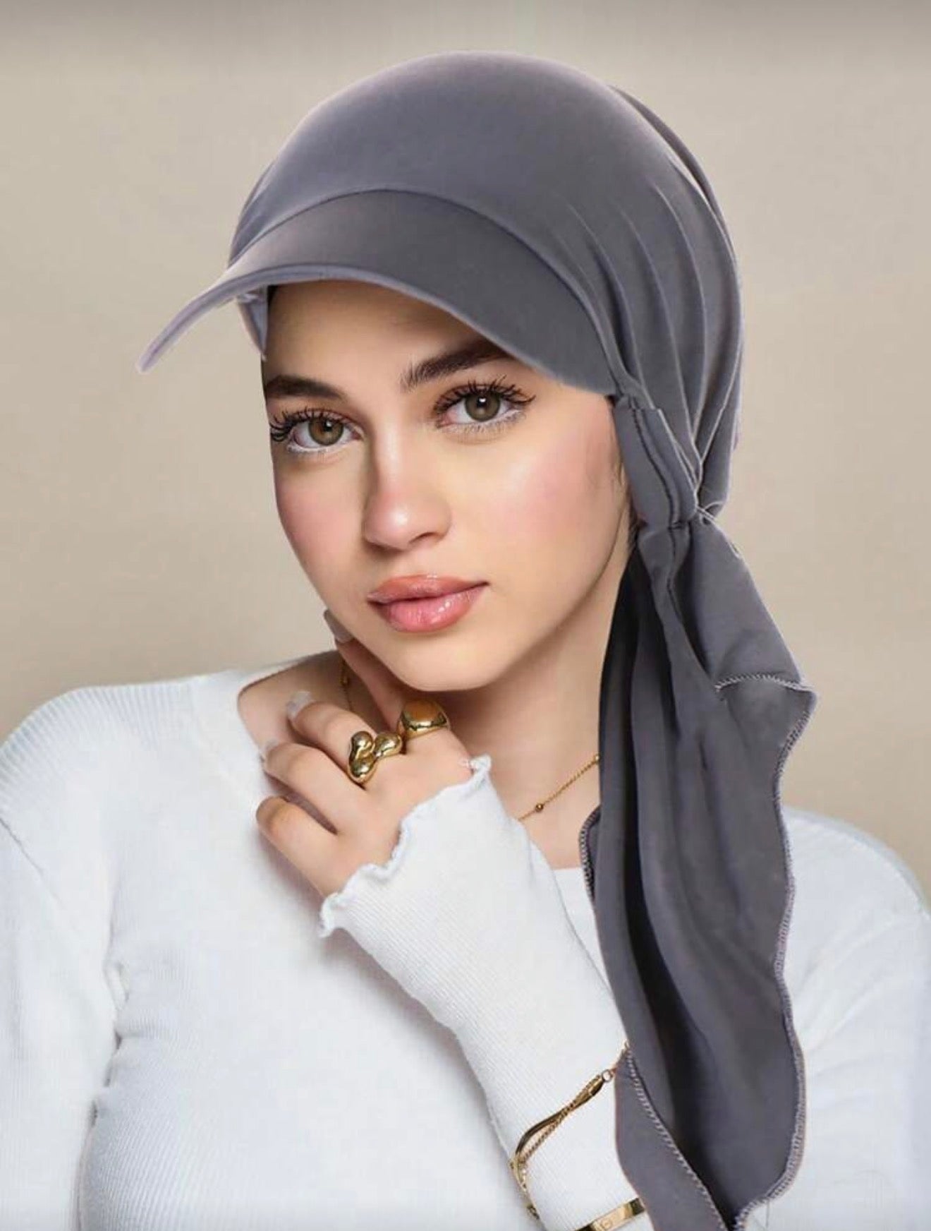 Model wearing grey Casual Hijab Cap with integrated baseball peak and wrap-around tail