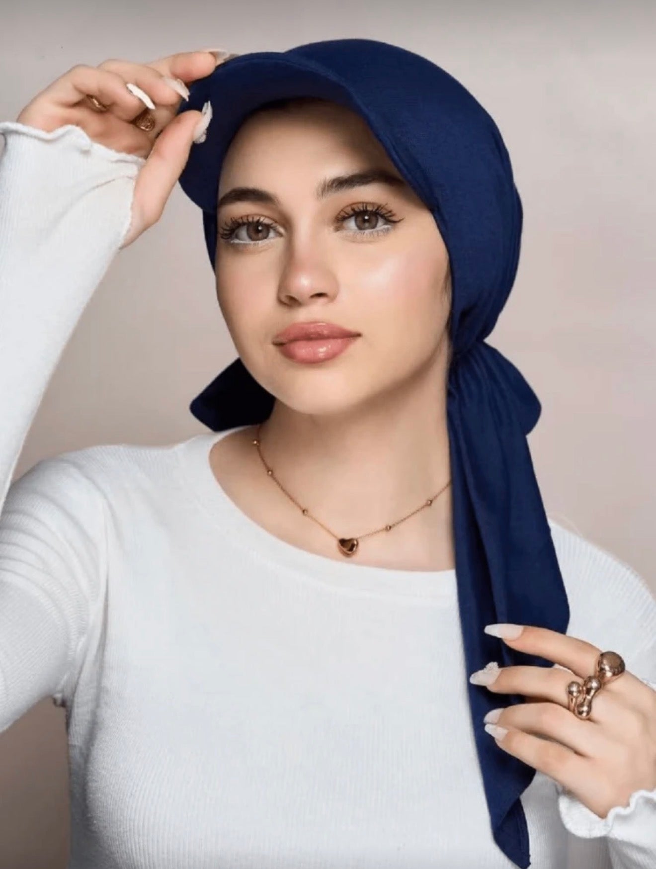 Model wearing Navy Casual Hijab Cap with integrated baseball peak and wrap-around tail