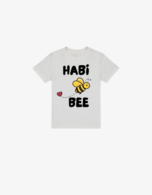 White kids t-shirt with a cute honeybee and heart illustration saying Habi Bee.