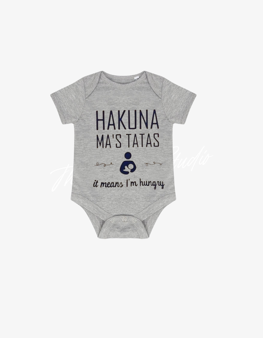 Grey baby grow with a nursing icon and the pun text Hakuna Ma's Tatas it means I'm hungry.
