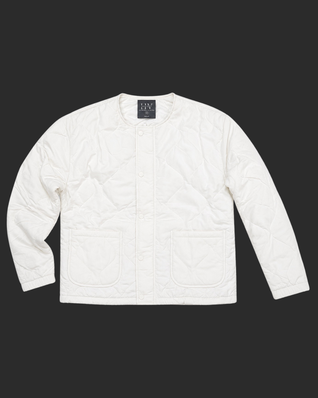 White quilted jacket on a black background