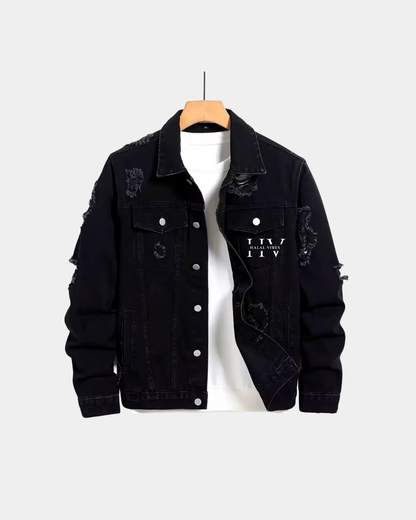 Front view of a black distressed denim jacket with HV Halal Vibes monogram on the chest.