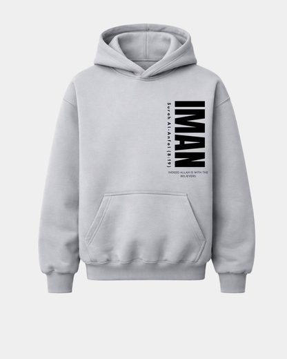 Heather grey heavyweight hoodie with a bold black vertical "IMAN" graphic and Quranic verse on the left side.