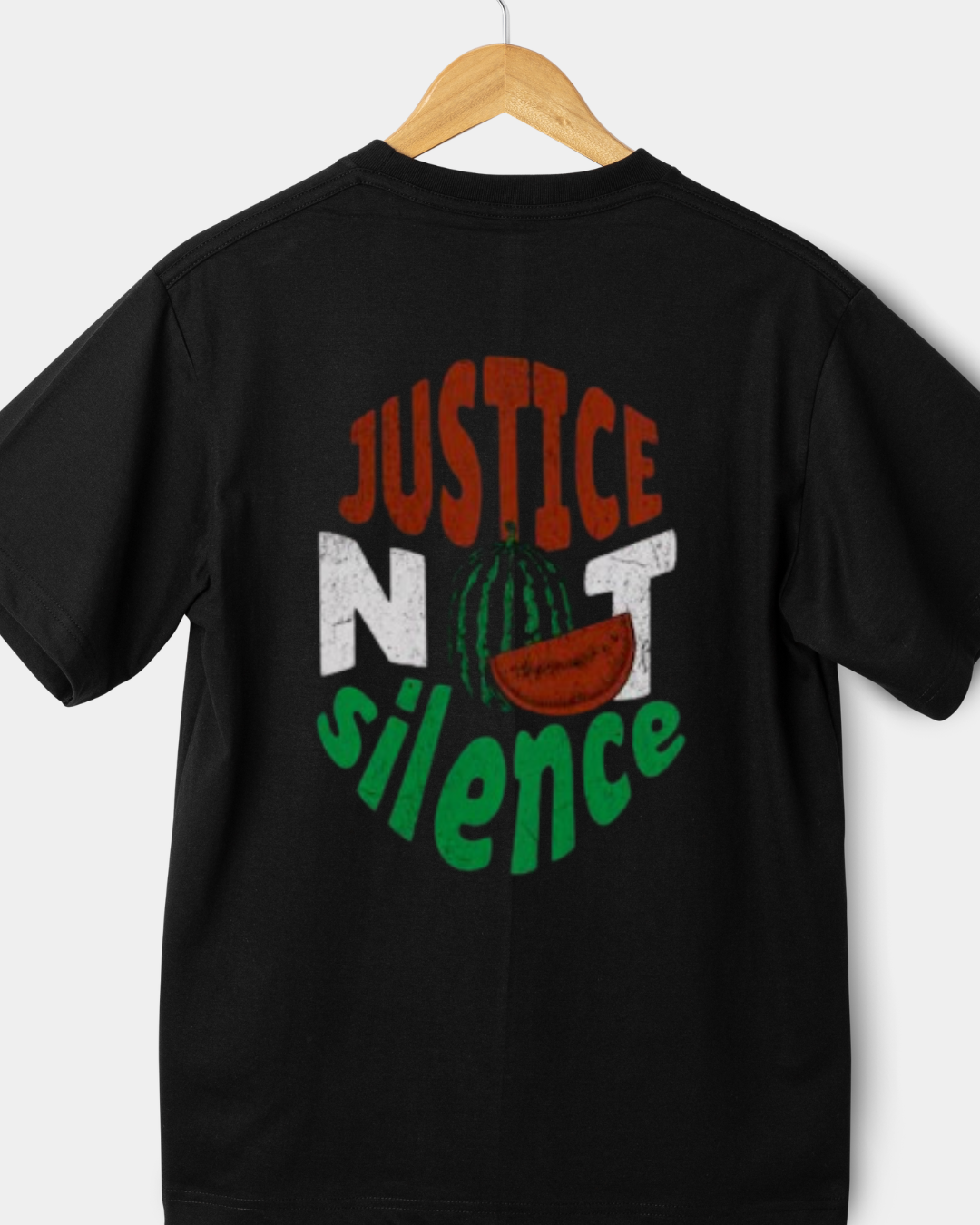 Rear view of a black 220gsm classic fit t-shirt with a circular red, white, and green "JUSTICE NOT SILENCE" graphic and a watermelon icon.