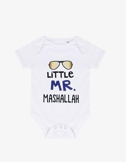 White baby grow with gold aviator sunglasses and text saying Little MR. MASHALLAH.