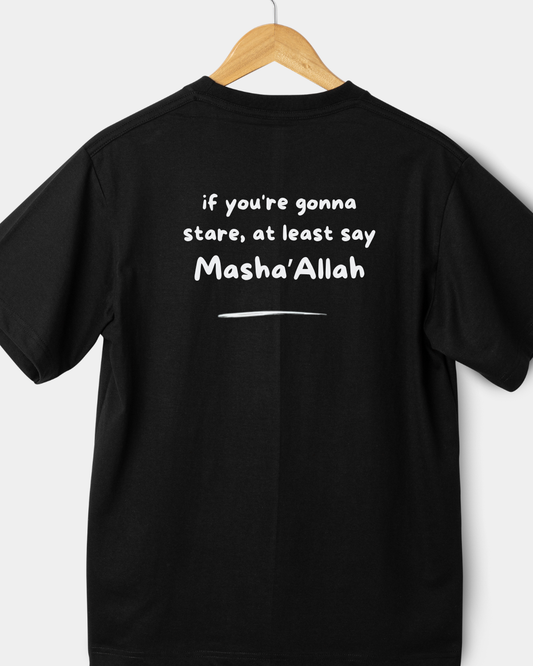 Rear view of a black 220gsm classic fit t-shirt with "if you're gonna stare, at least say Masha'Allah" in white text.