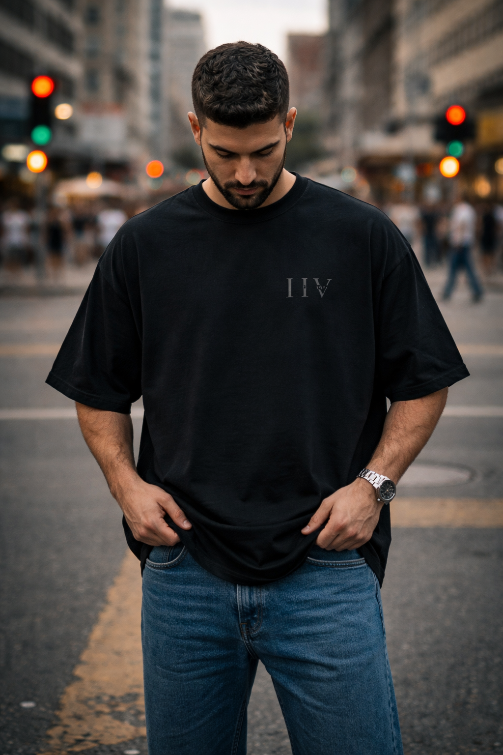 Man wearing a black t-shirt with 'HIV' logo on a city street