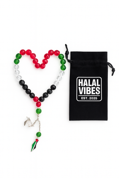 Close up of red green black and white crystal beads Islamic prayer tasbih