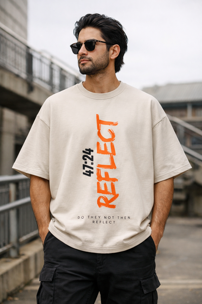 Model wearing the Halal Vibes REFLECT 47:24 t-shirt in a modern urban setting.