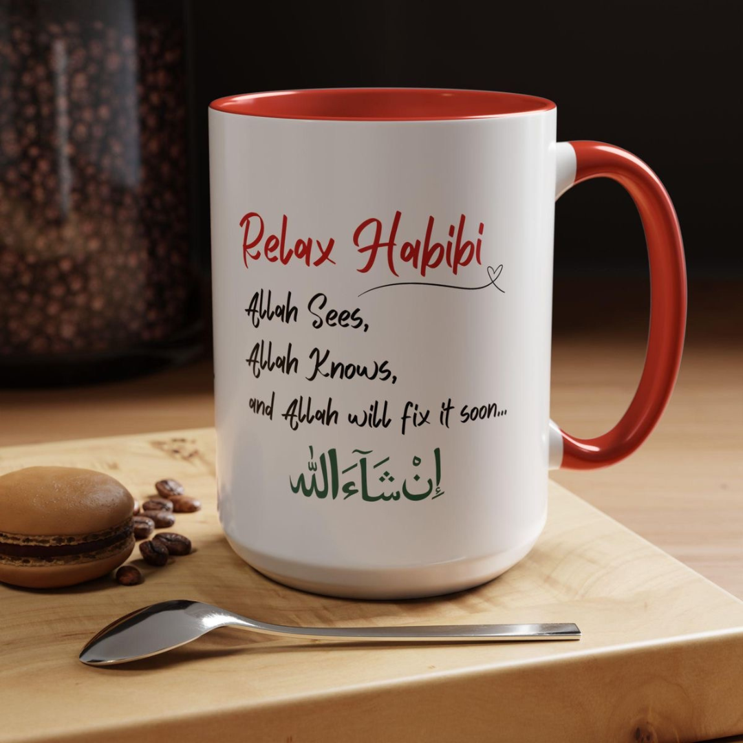 White ceramic mug with red handle and interior featuring the text Relax Habibi and Insha'Allah in Arabic.