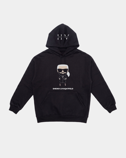 Front view of the black 360 GSM heavyweight hoodie showing the white HV monogram on the hood and a central Karl Lagerfeld parody graphic reading SHEIKH LIYAQATFELD.